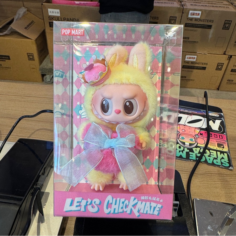 Pop Mart Yellow and Pink Collectible Figure